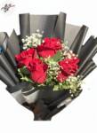 black-wrapping-red-roses-babys-breath-bouquet-flowers-studio