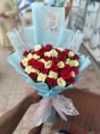 red-yellow-roses-bouquet-with-blue-wrap
