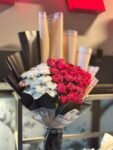 elegant-red-roses-white-carnations-two-tone-wrapped-bouquet