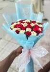 red-yellow-roses-bouquet-with-blue-wrap