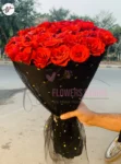 premium-red-roses-circle-bouquet-black-net-golden-dots-faisalabad