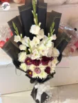 imported-black-wrapping-white-gladiolus-purple-craze-bouquet