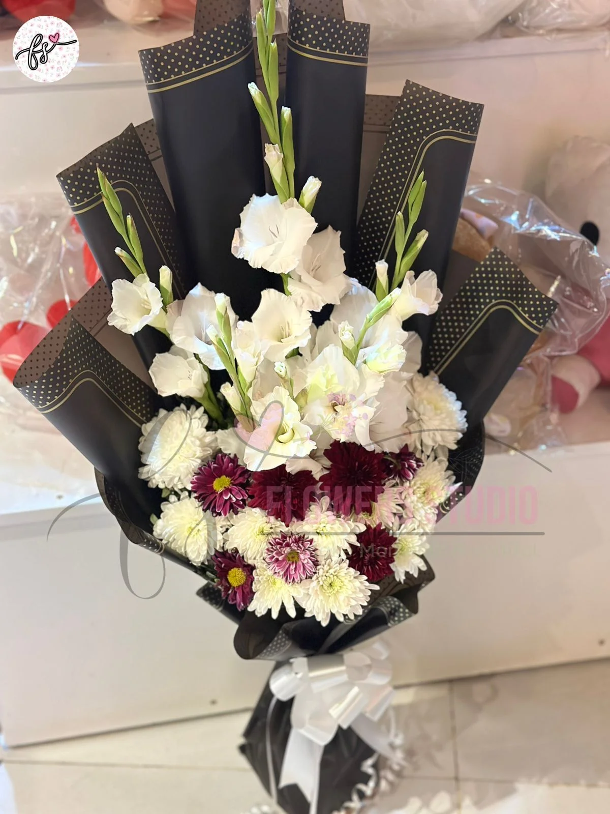 fresh-flower-bouquet-faisalabad-white-gladiolus-purple-craze Imported Black Wrapping White Gladiolus Purple Craze Bouquet
