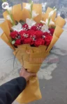 red-roses-white-gladiolus-babys-breath-bouquet-yellow-wrapping-faisalabad